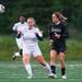 Huron's Casie Ammerman and Skyline's Mackenzie Stites  run after the ball during the second half of their game against Skyline, Thursday May 23.
Courtney Sacco I AnnArbor.com  
